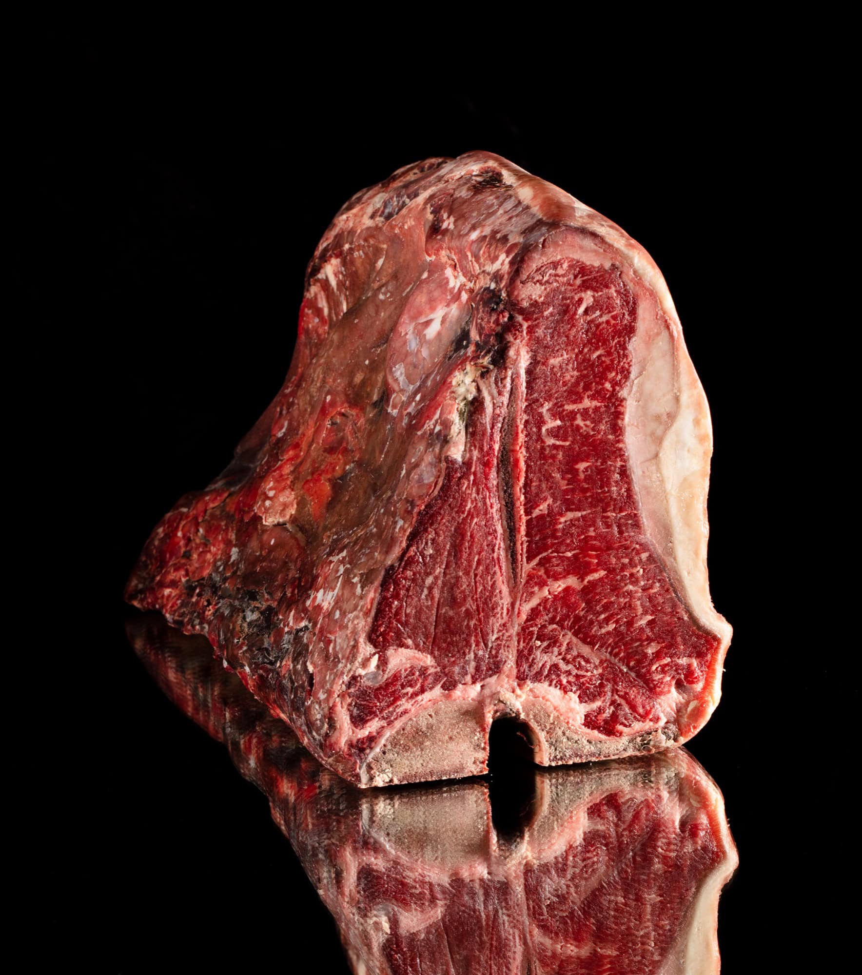 Frozen beef cut on dark background